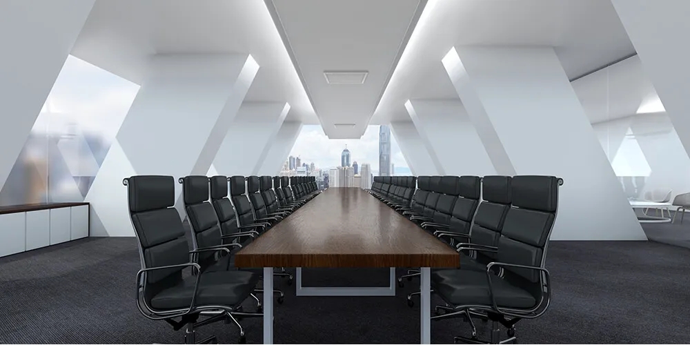 Modern boardroom with long wooden table and black swivel chairs